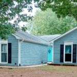 Single-story ranch painted in earl grey.